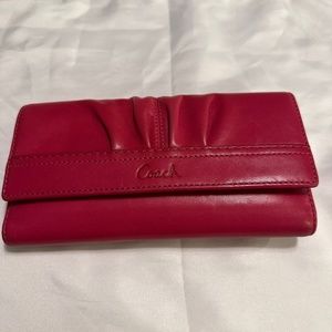 Coach pink wallet.